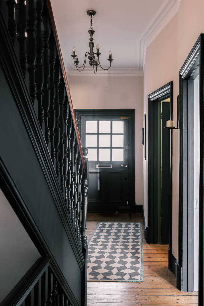 Playful Colors in a Historic Home in Kent 9 hallway-black-staircase-wooden-floor-nordroom