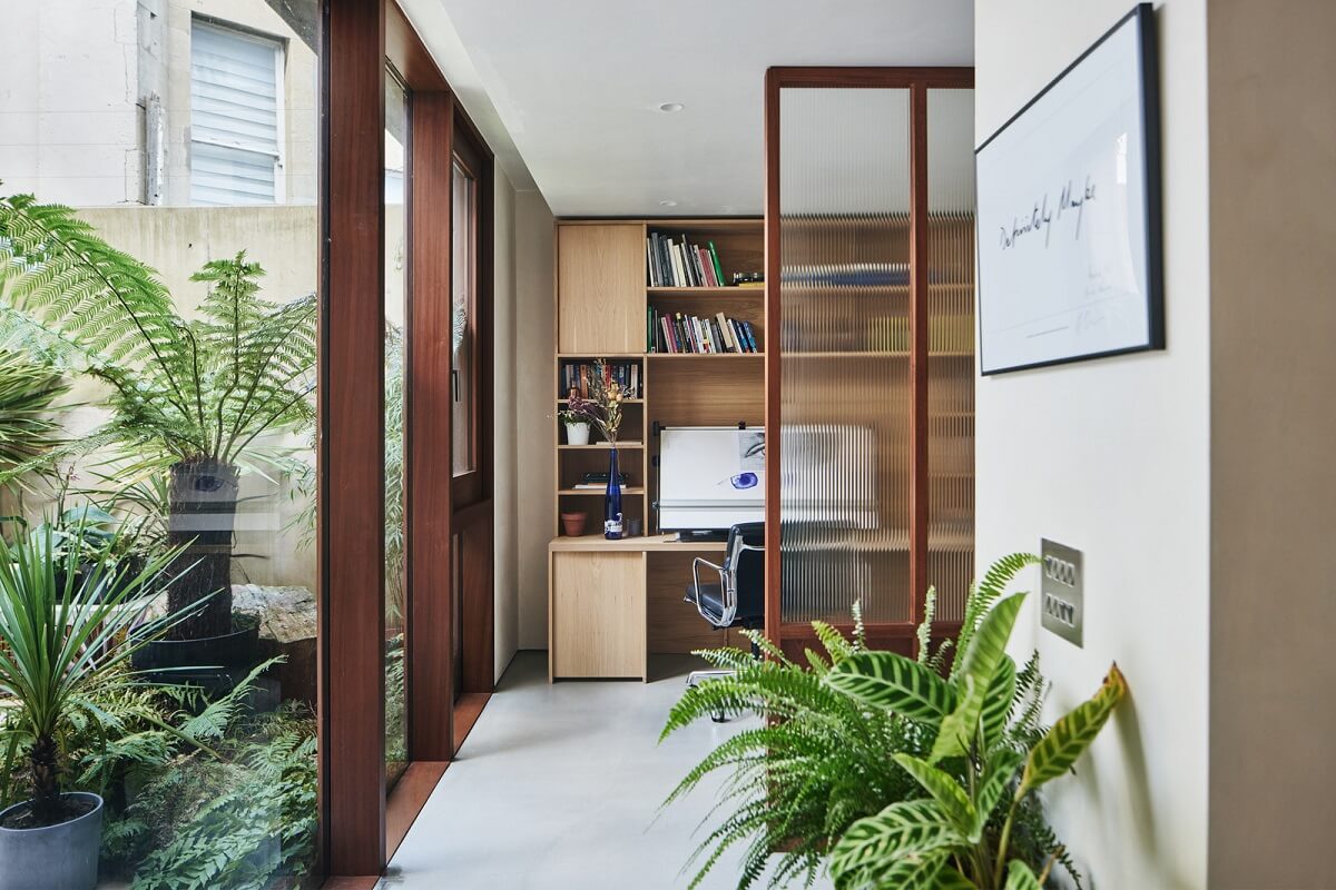 A Modern House Centered Around a Courtyard 10 home-office-wooden-accent-wall
