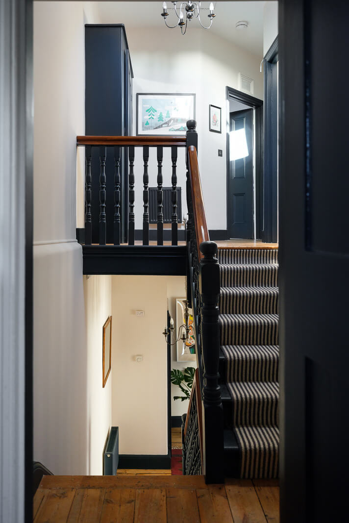 Playful Colors in a Historic Home in Kent 11 landing-wooden-floor-black-stairs-nordroom