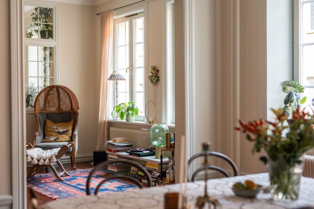 A Cozy Swedish Apartment with a Green Kitchen 14 living-room-view-from-kitchen.jpg