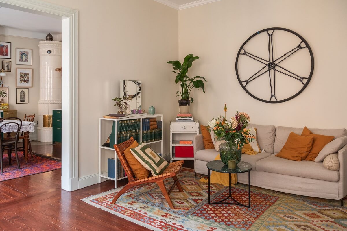 A Cozy Swedish Apartment with a Green Kitchen 4 living room with warm mahogany stained floorboards nordroom