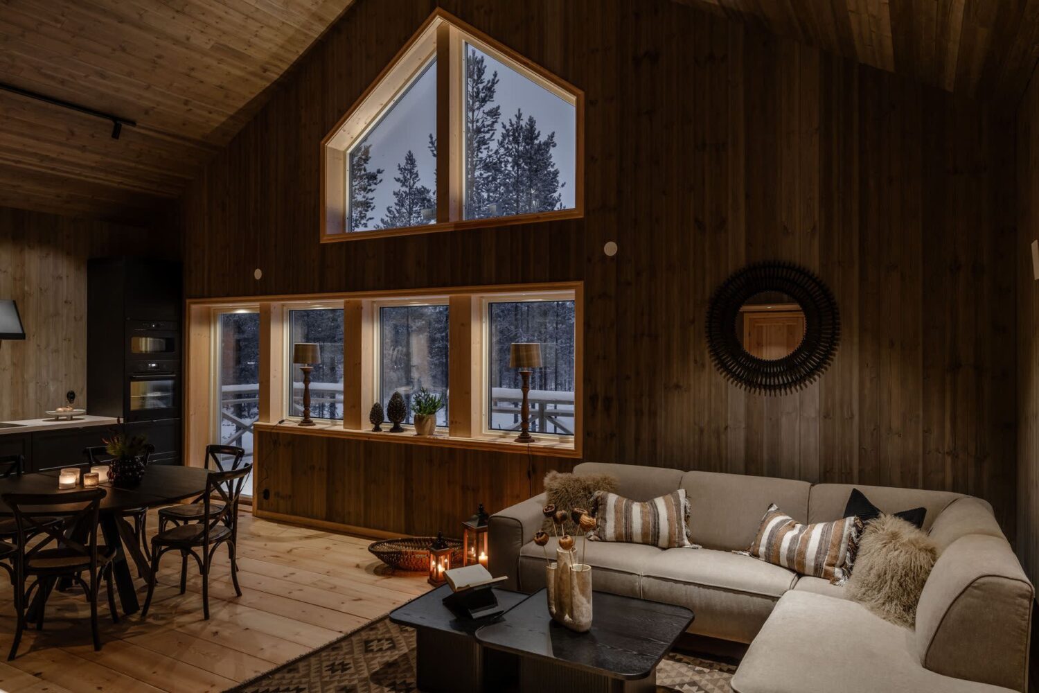 A Cozy Log House in Sweden 2 open-plan-living-room-kitchen-pitched-ceiling-log-house-nordroom