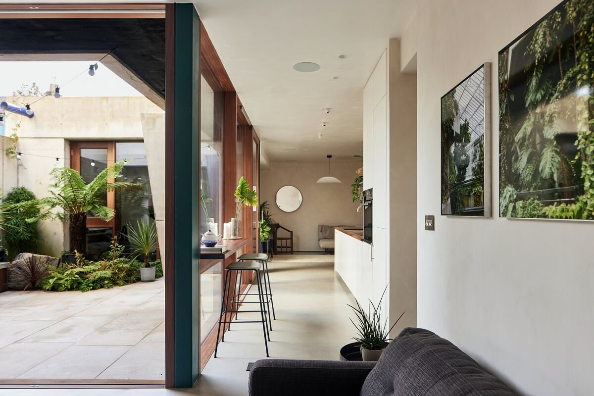 A Modern House Centered Around a Courtyard 4 open-plan-living-spaces-bar-table-in-front-window-nordroom