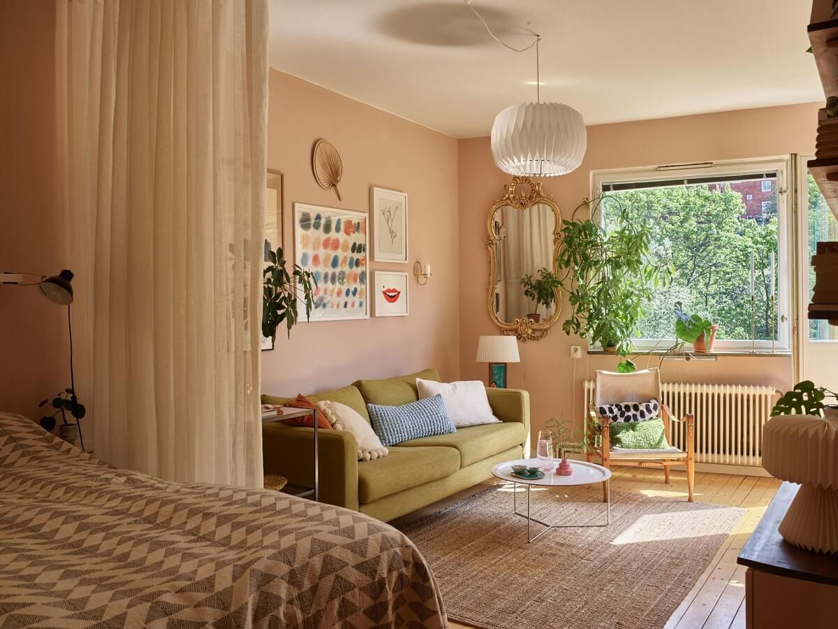 Best of 2023: Studio Apartments 5 pink studio apartment green sofa curtain room divider nordroom