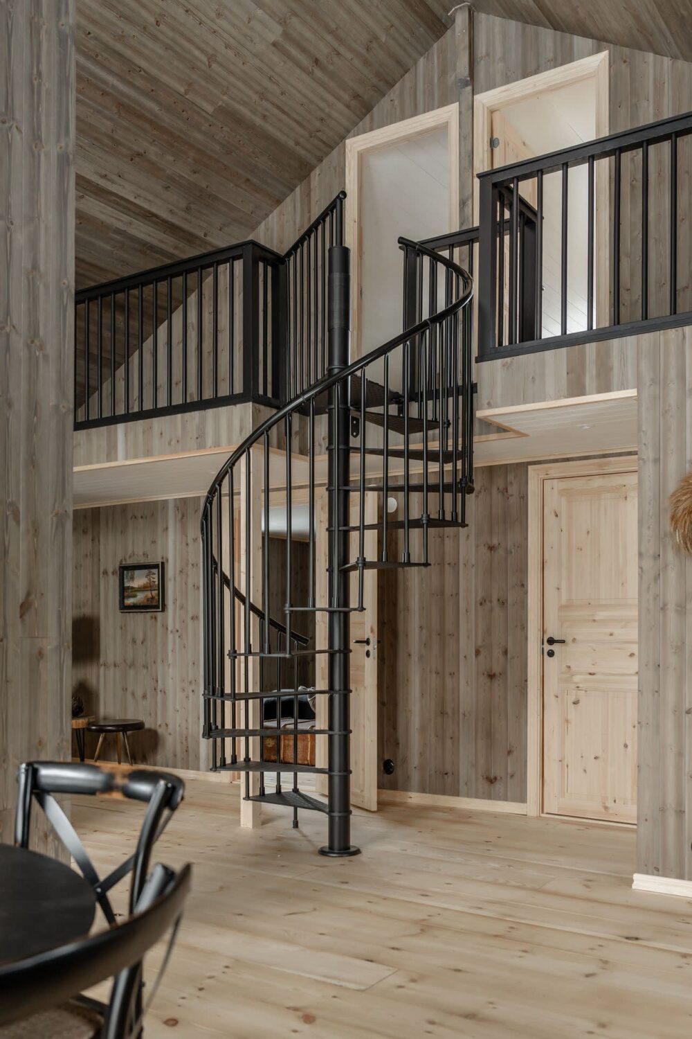 A Cozy Log House in Sweden 14 spiral-staircase-log-house-sweden-nordroom