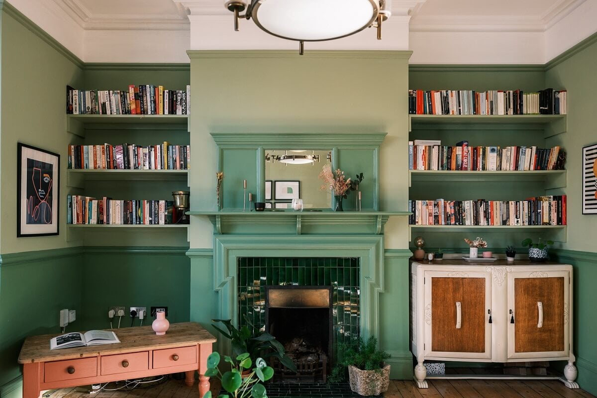 Playful Colors in a Historic Home in Kent 1 two-tone-green-walls-fireplace-built-in-shelves-nordroom