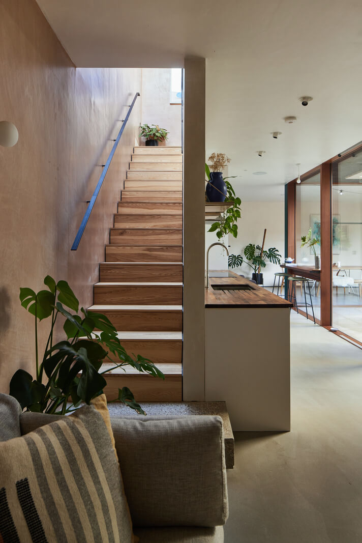 A Modern House Centered Around a Courtyard 14 wooden-staircase