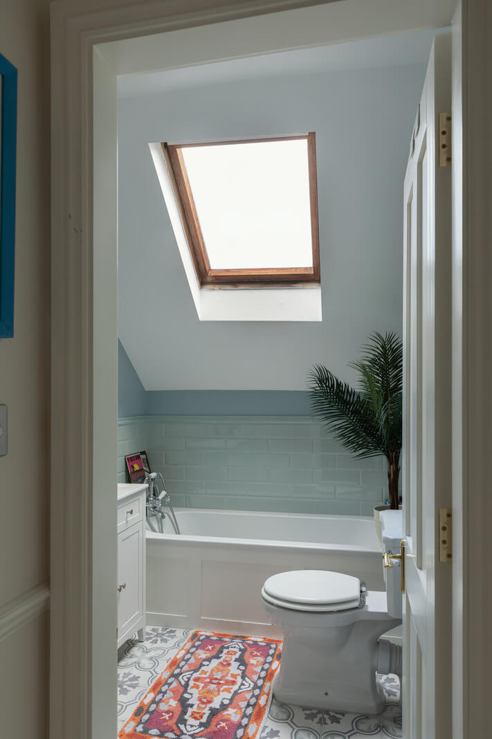 A Victorian House in London with Three Outdoor Spaces 21 bathroom slanted ceiling skylight