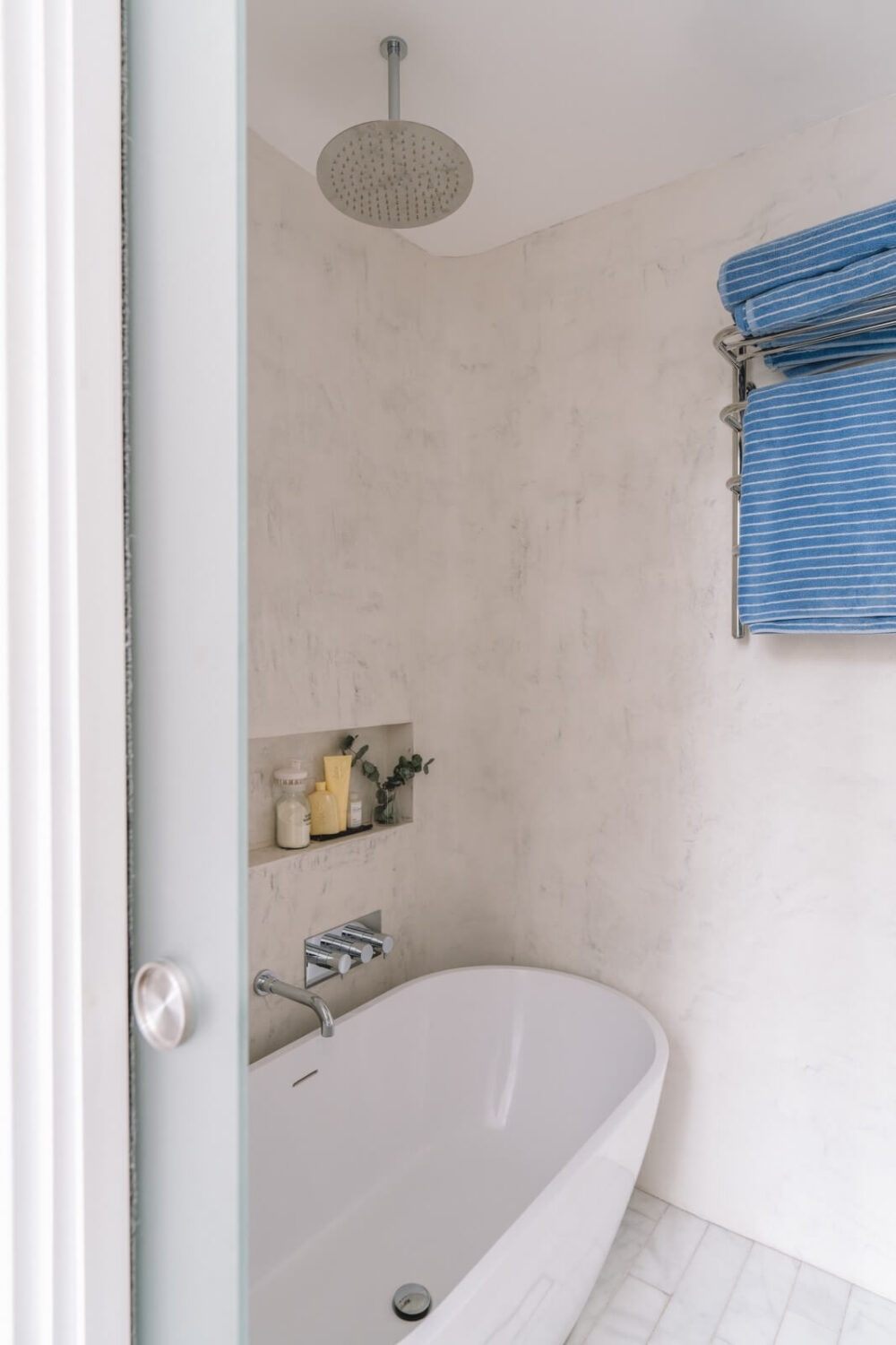 High Ceilings and Modern Design in a Light London Apartment 15 bathroom with modern bath and shower