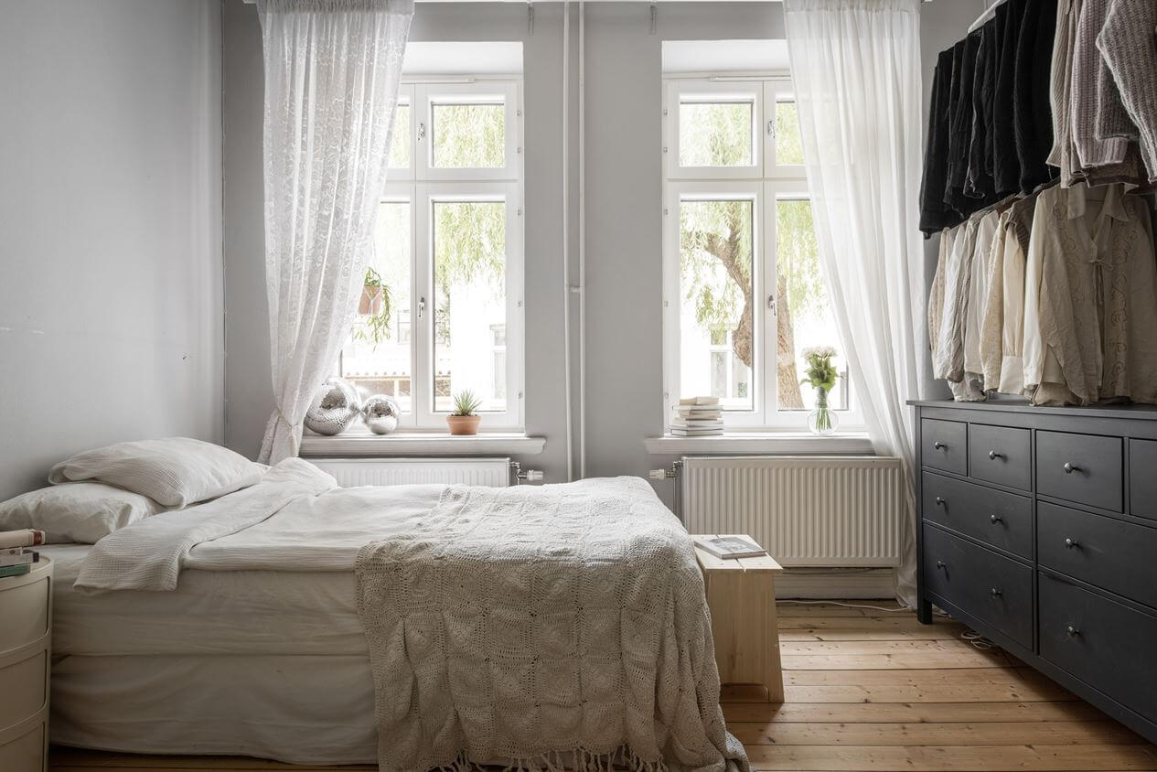 A Studio Apartment with Vintage Decor 5 bed-open-wardrobes-wooden-floor-studio