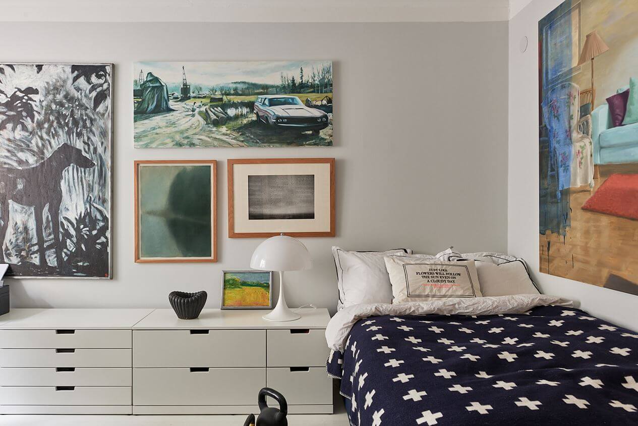 An Art-Filled Scandinavian Apartment 18 bedroom-art-gallery-wall-low-cabinets-nordroom