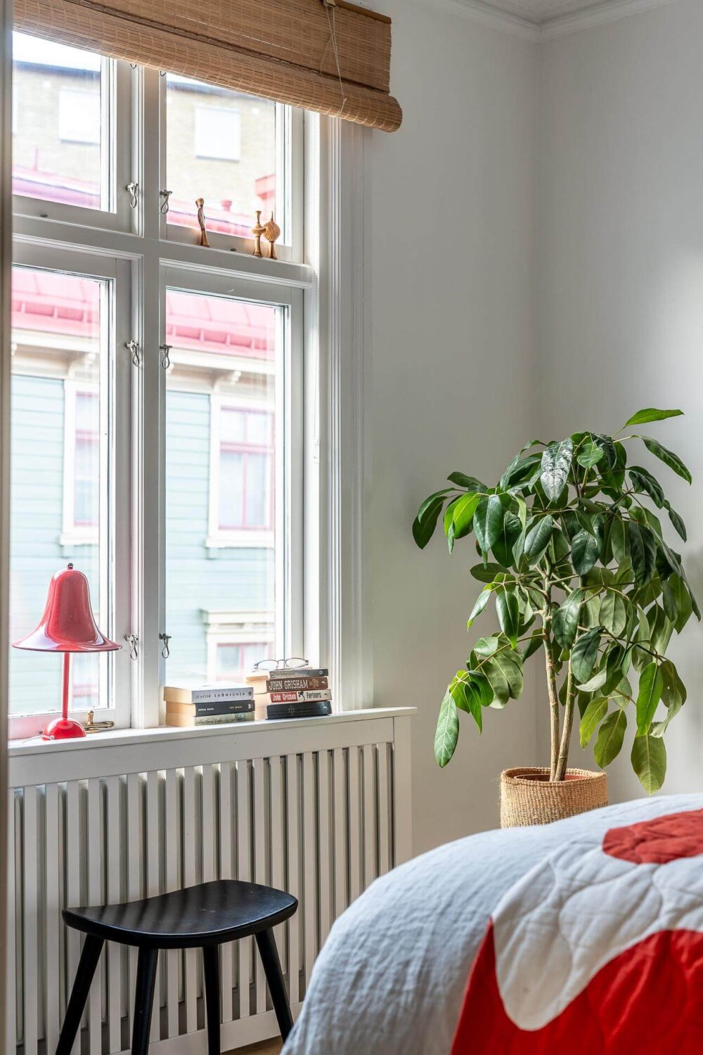 Primary Color Accents in a Light Swedish Apartment 12 bedroom-detail