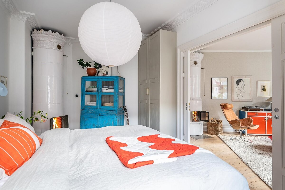 Primary Color Accents in a Light Swedish Apartment 15 bedroom-view-to-living-room-fireplace-nordroom