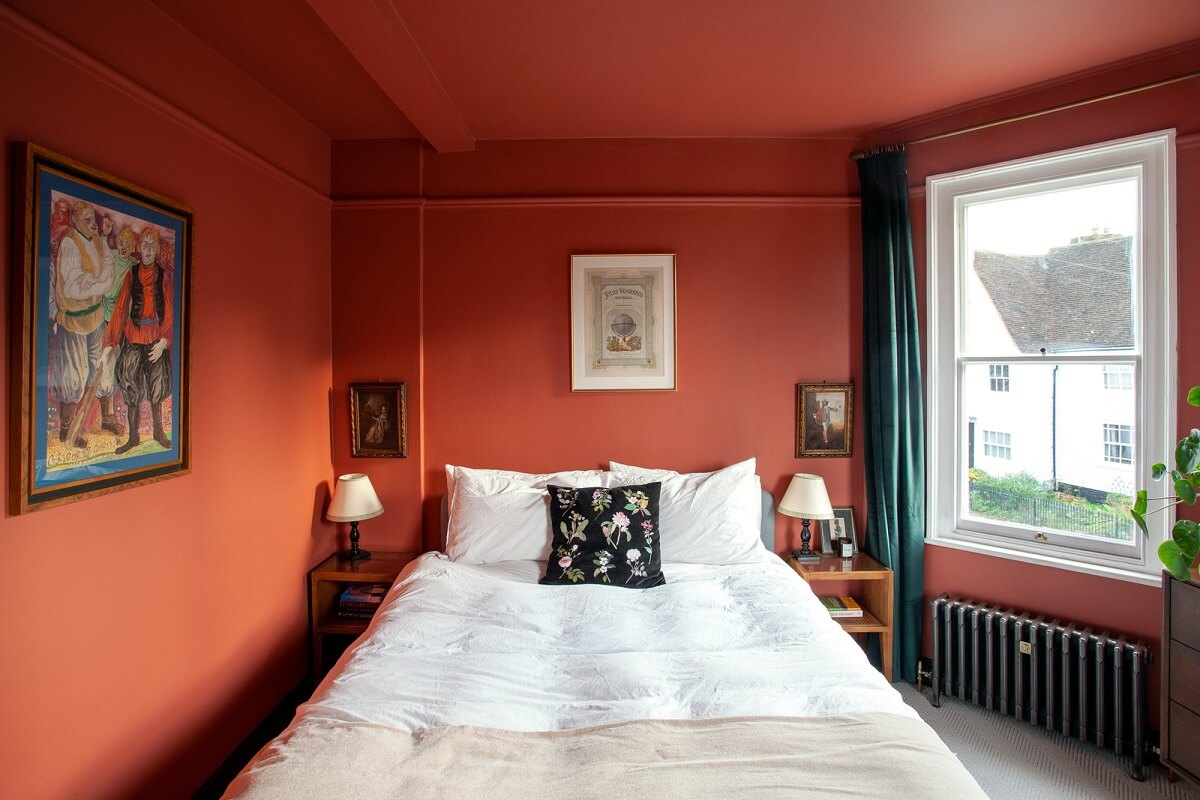 Bold Colors in a Charming Historic House in England 19 bedroom-with-orange-pink-walls-ceiling-nordroom