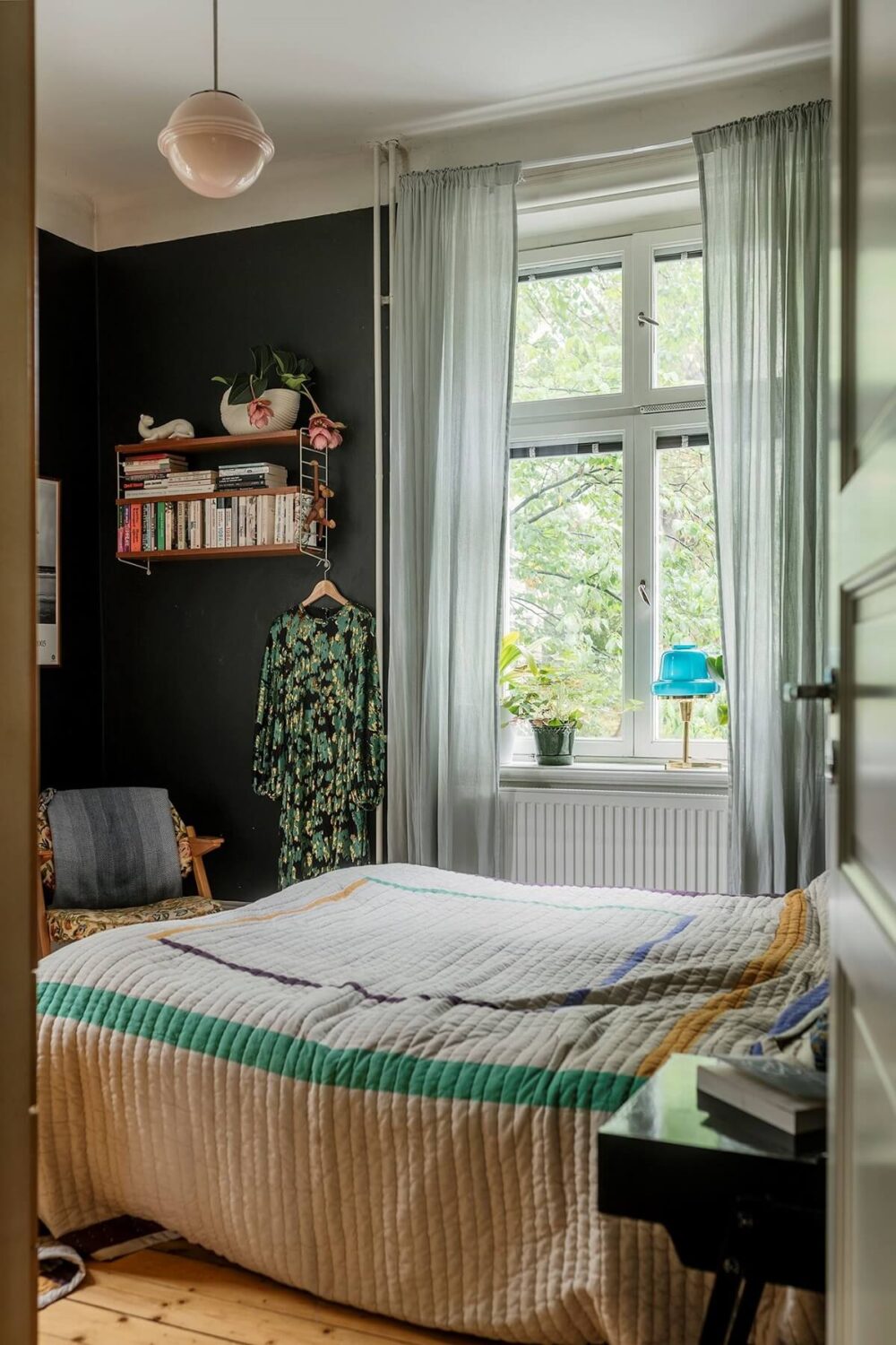 A Swedish Apartment with a Yellow Living Room 7 bedroom wooden floor black walls nordroom