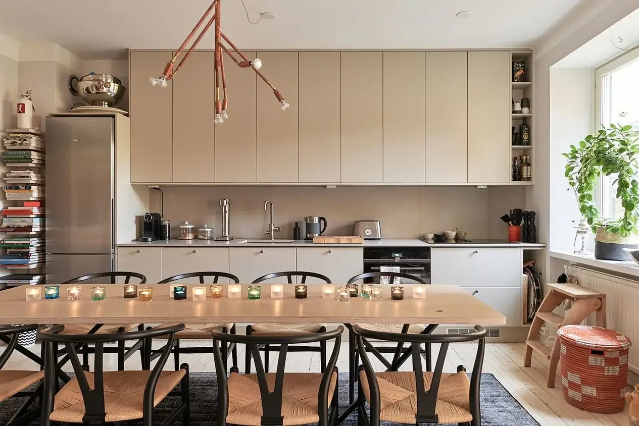An Art-Filled Scandinavian Apartment 9 beige-kitchen-large-dining-table