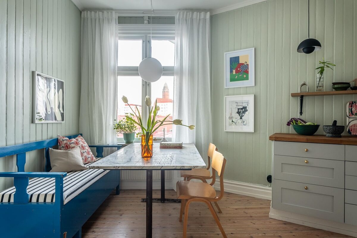 Primary Color Accents in a Light Swedish Apartment 19 blue-bench-light-green-walls-kitchen-nordroom