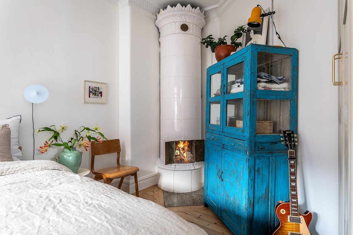Primary Color Accents in a Light Swedish Apartment 13 blue-wardrobe-fireplace-bedroom-nordroom