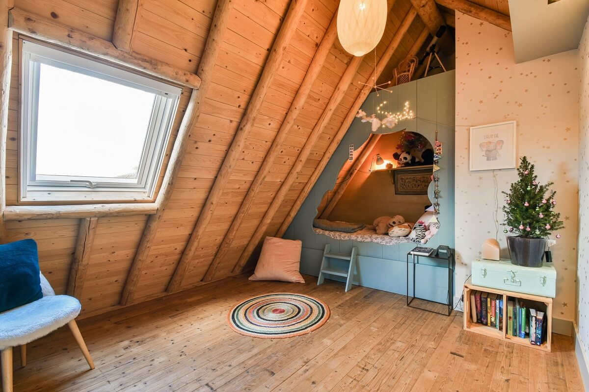 Wooden Interiors in a Historic Dutch Family Home 23 child-room-blue-built-in-bed-wooden-slanted-ceiling-nordroom