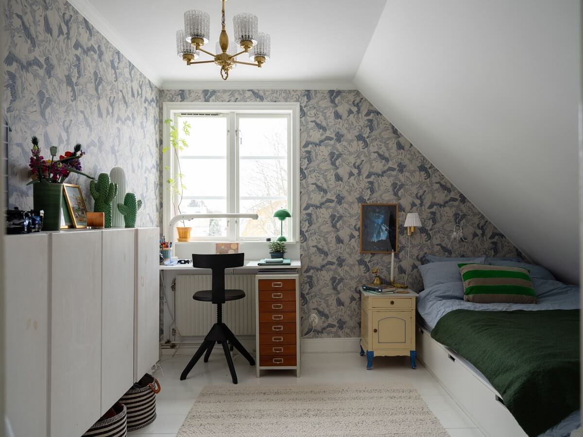 A Light Family Home in a Historic Yellow Villa 25 children bedroom blue wallpaper slanted ceiling nordroom