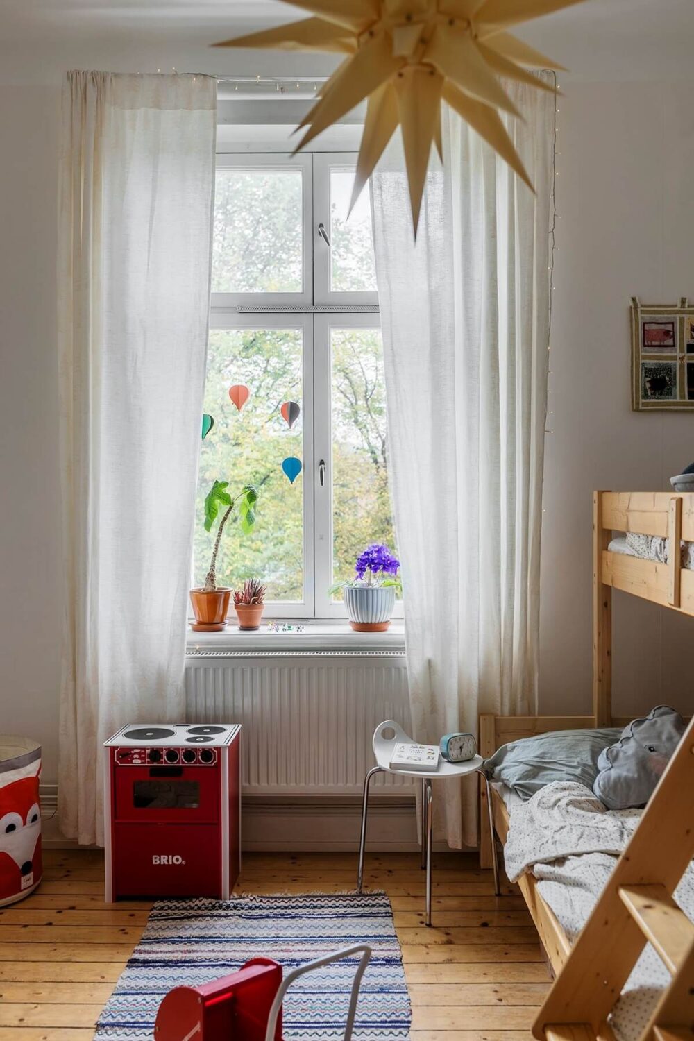 A Swedish Apartment with a Yellow Living Room 12 childrens room with wooden bunk bed