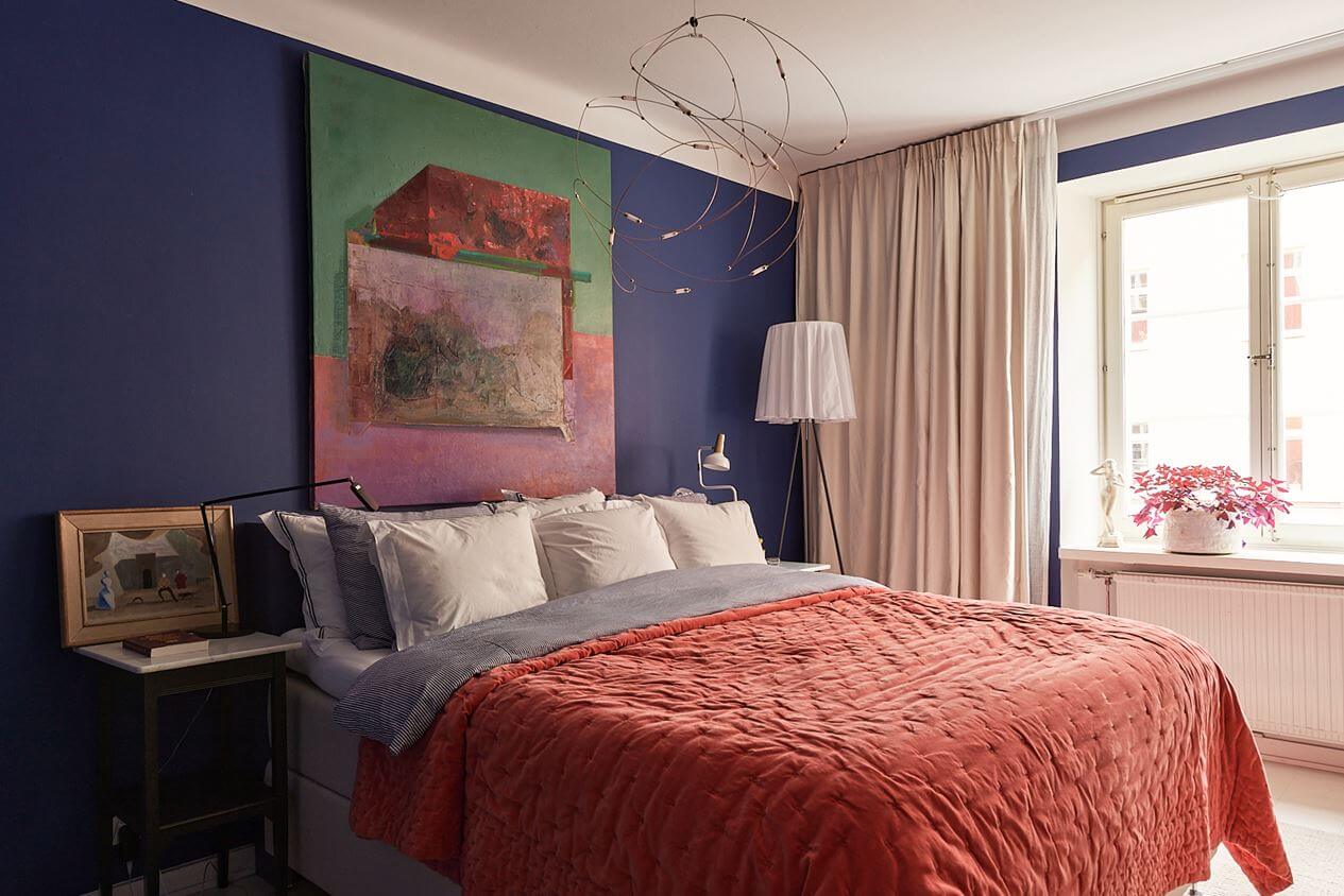 An Art-Filled Scandinavian Apartment 14 colorful-bedroom-dark-violet-blue-walls-nordroom