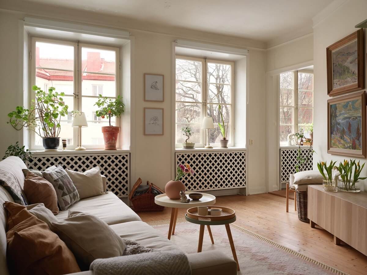 A Charming Swedish Apartment with a Cottage-Style Kitchen 1 cozy scandinavian living room wooden floor nordroom
