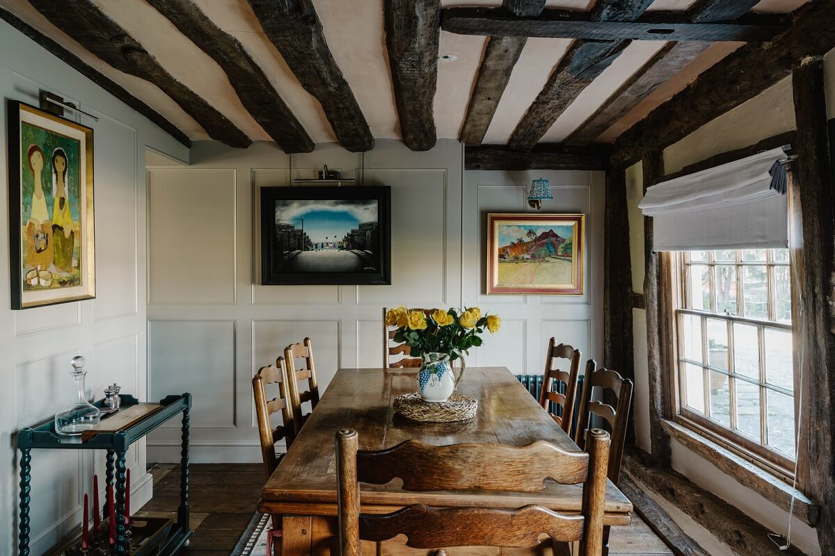 A Cozy Historic English Country House with Exposed Beams 11 dining room exposed wooden beams historic country house nordroom