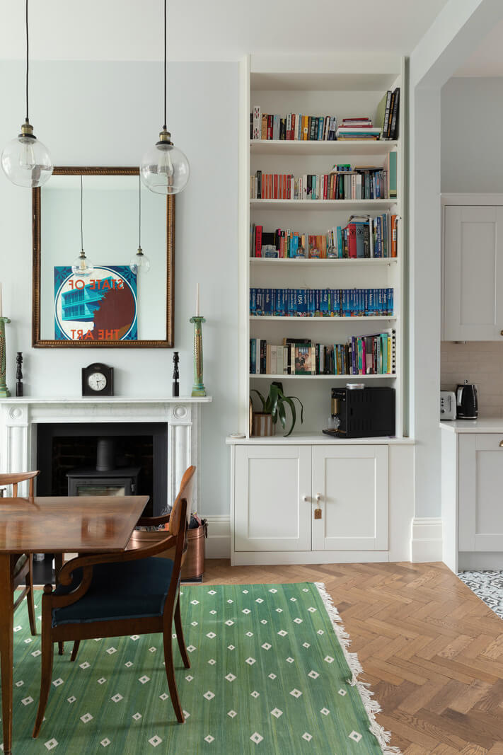 A Victorian House in London with Three Outdoor Spaces 4 dining room green rug bookshelves nordroom