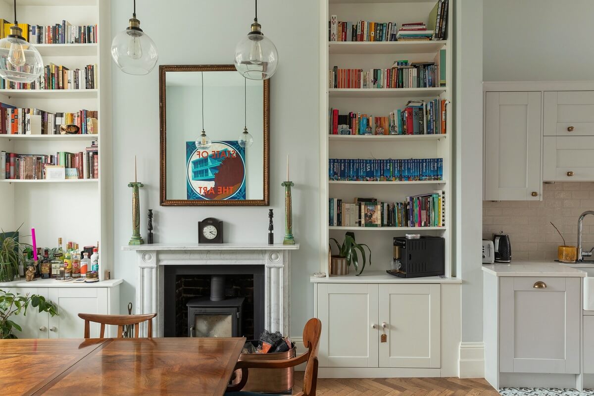 A Victorian House in London with Three Outdoor Spaces 2 dining room with fireplace and bookshelves