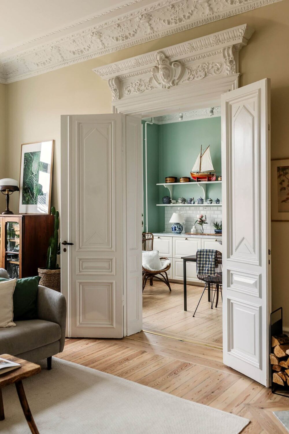Stunning Fireplaces in a Historic Stockholm Apartment 7 double-doors-living-room