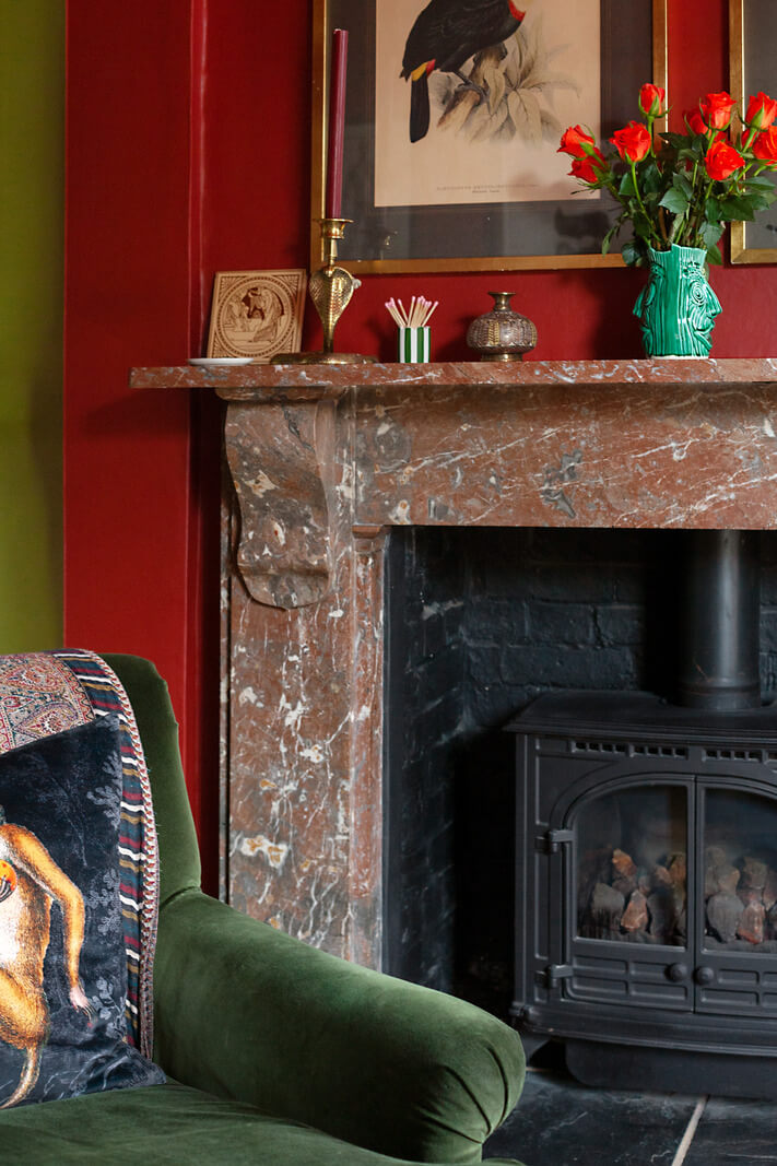Bold Colors in a Charming Historic House in England 6 fireplace-red-living-room-nordroom