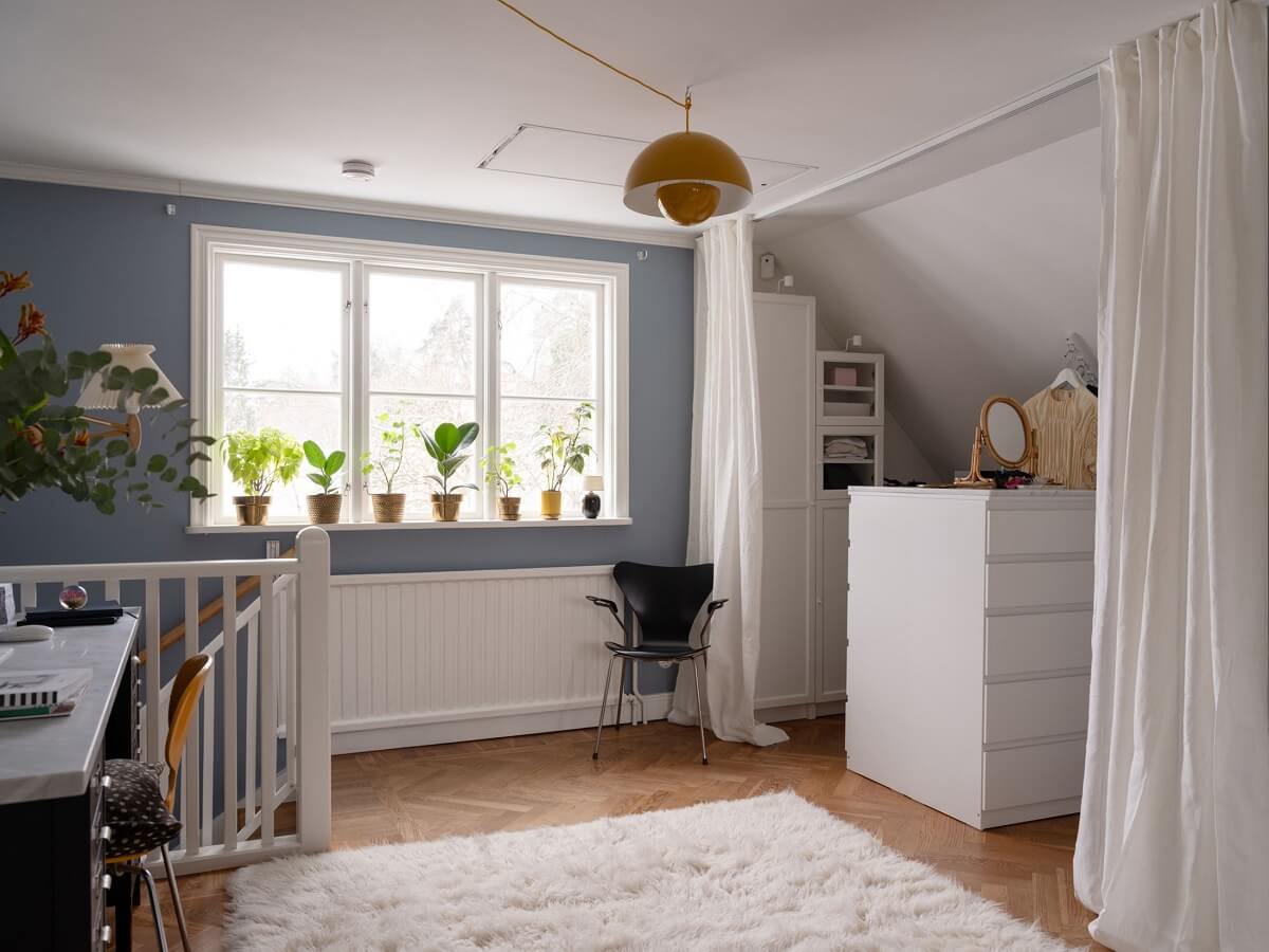 A Light Family Home in a Historic Yellow Villa 20 first floor landing with storage space behind curtain nordroom