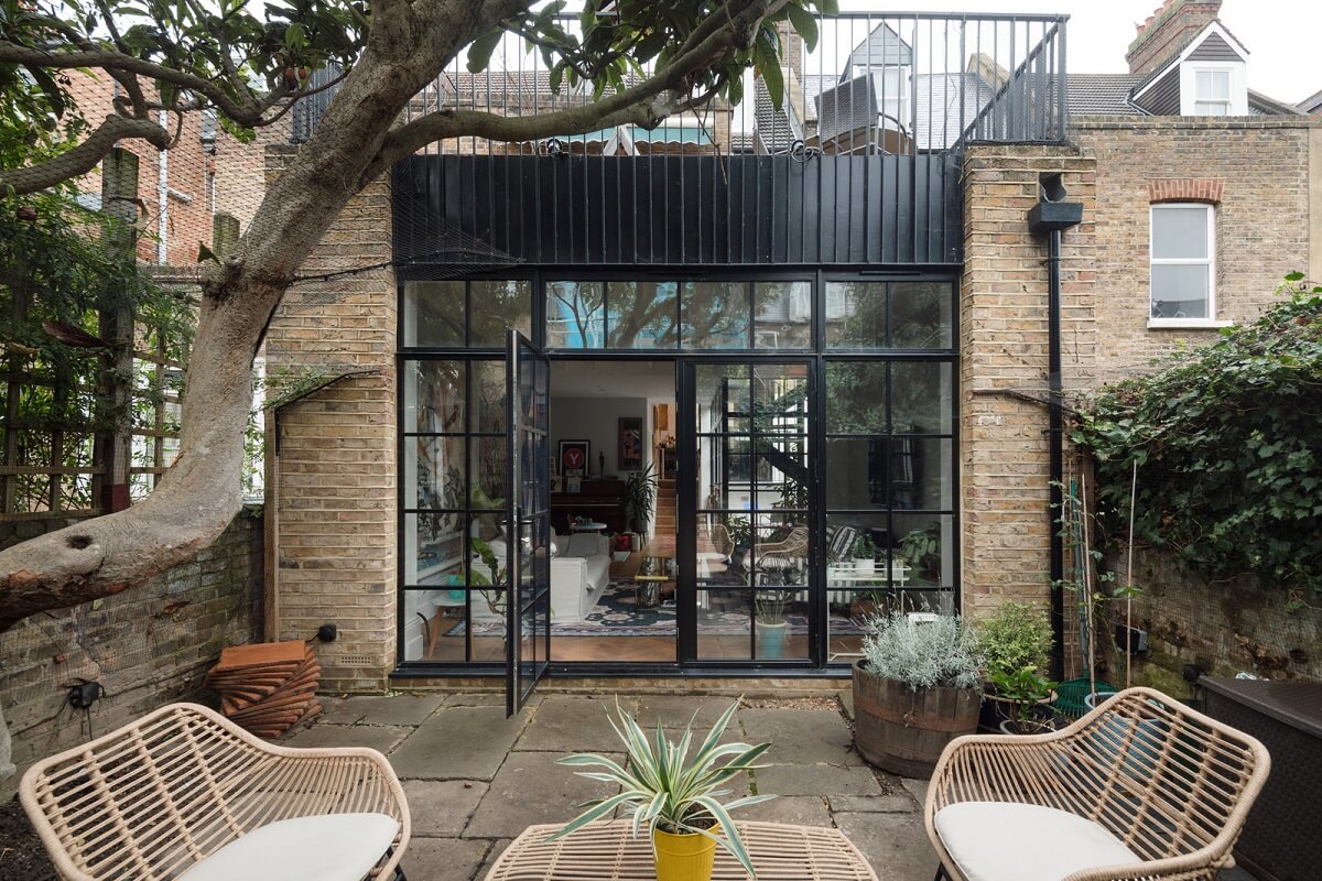 A Victorian House in London with Three Outdoor Spaces 14 garden with black glass extension