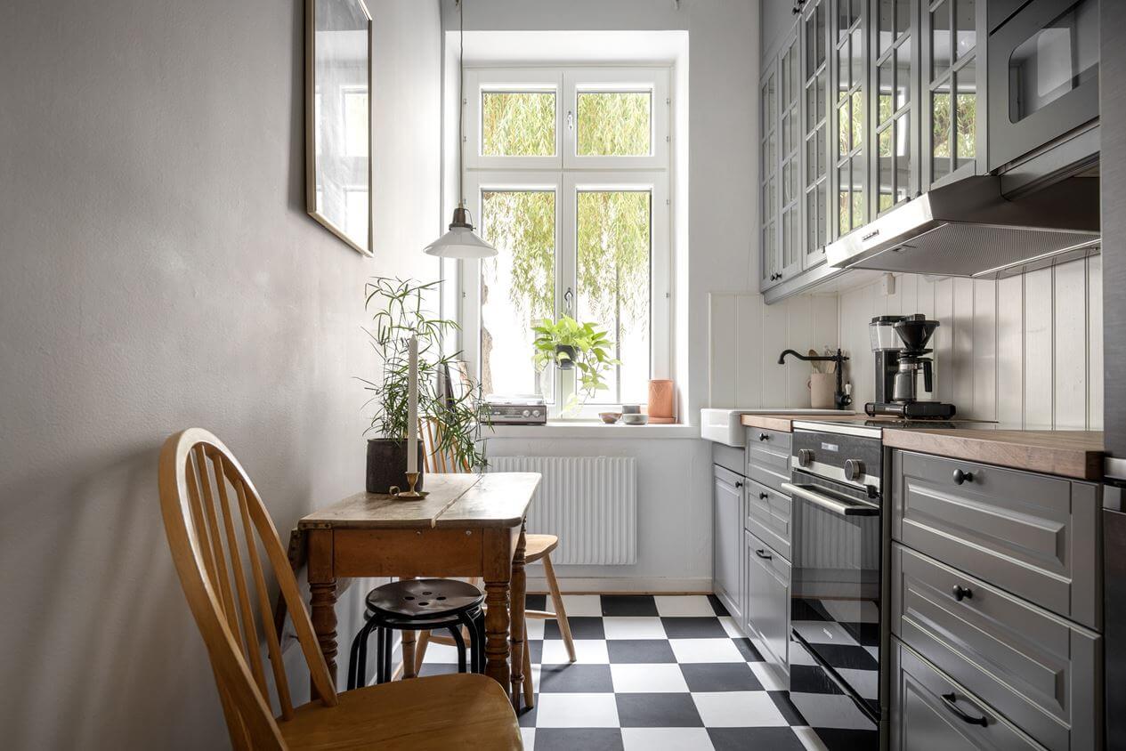 A Studio Apartment with Vintage Decor 7 gray-kitchen-checkerboard-floor