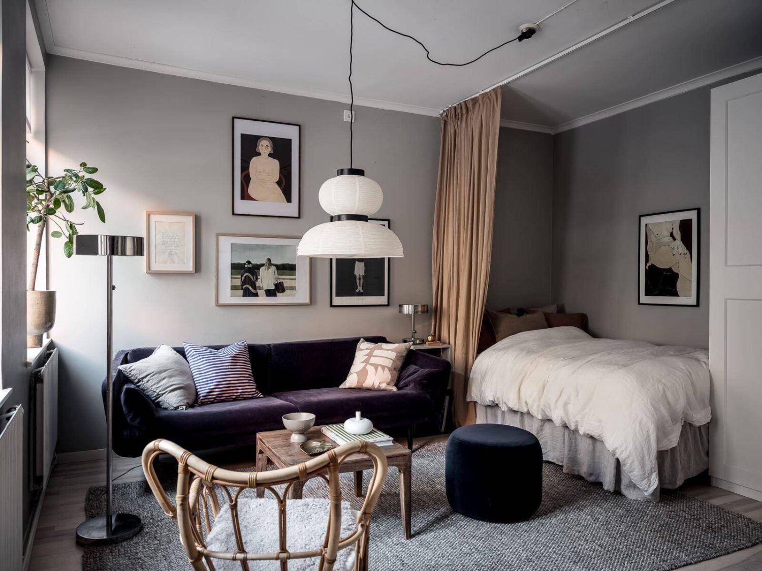 How To Decorate A Studio Apartment 26 gray scandinavian studio apartment purple sofa curtain room divider nordroom