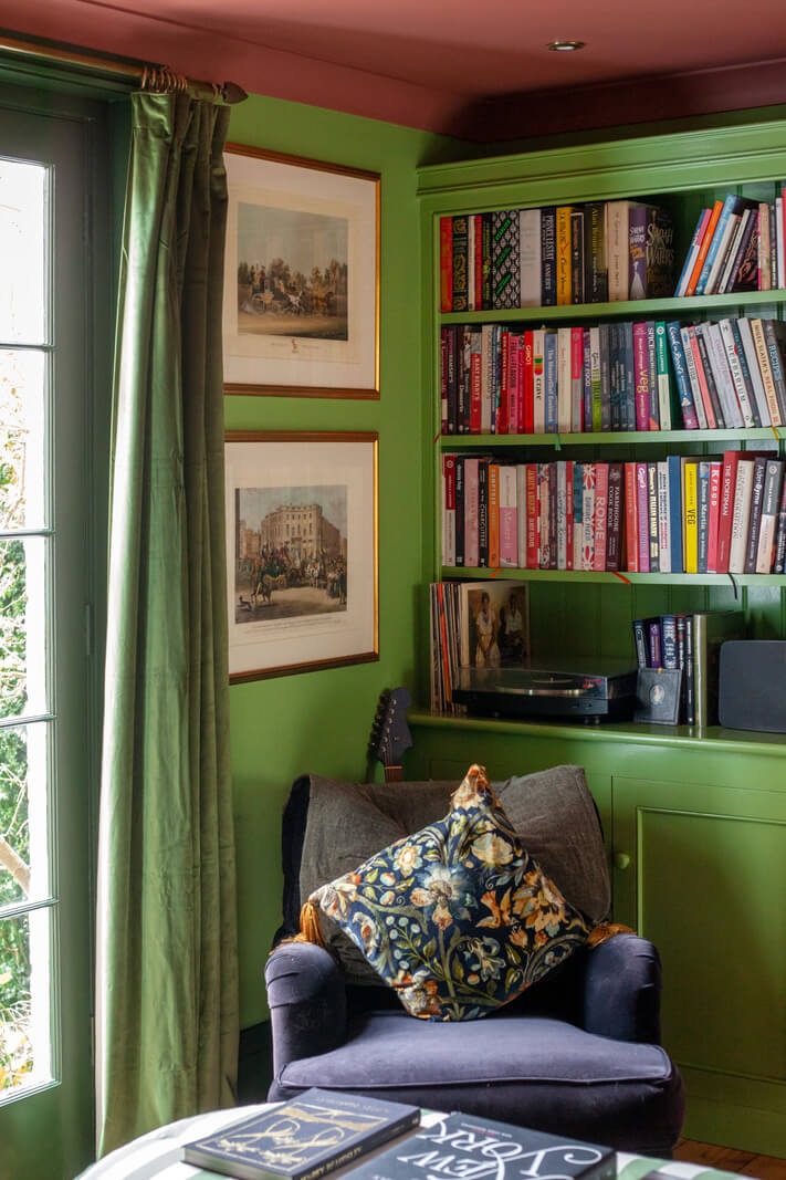 Bold Colors in a Charming Historic House in England 9 green-bookcases-pink-ceiling-nordroom