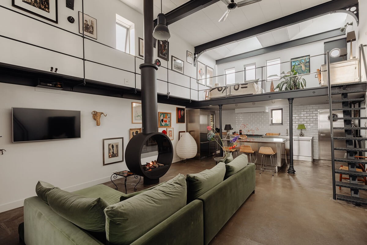 An Industrial Loft Apartment in Amsterdam 5 green-sofa-steel-beams-loft-nordroom