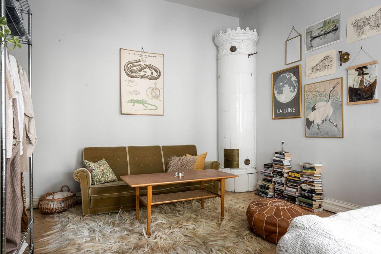 How To Decorate A Studio Apartment 11 green-vintage-sofa-round-fireplace-nordroom