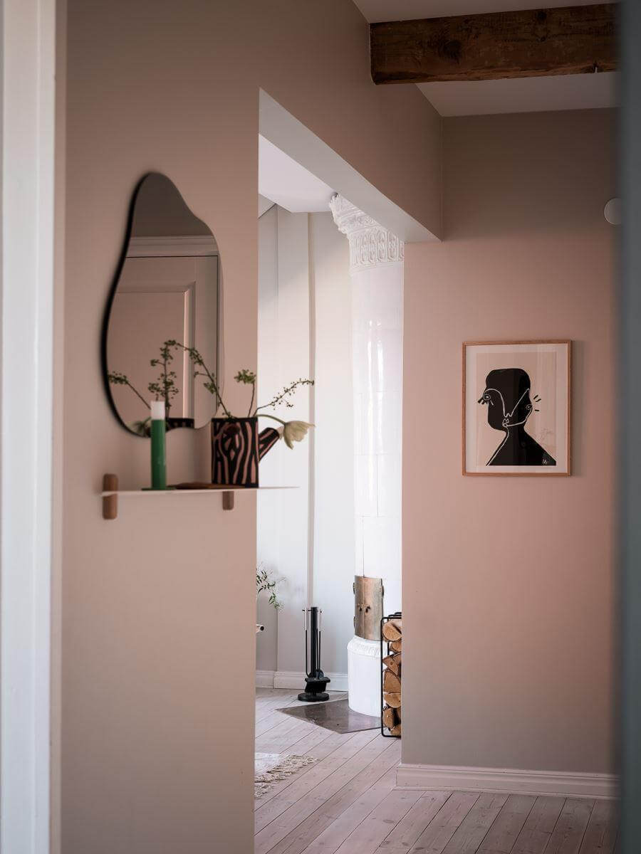 A Light-Filled Swedish Duplex is a Lovely Family Home 13 hallway exposed beams mirror nordroom