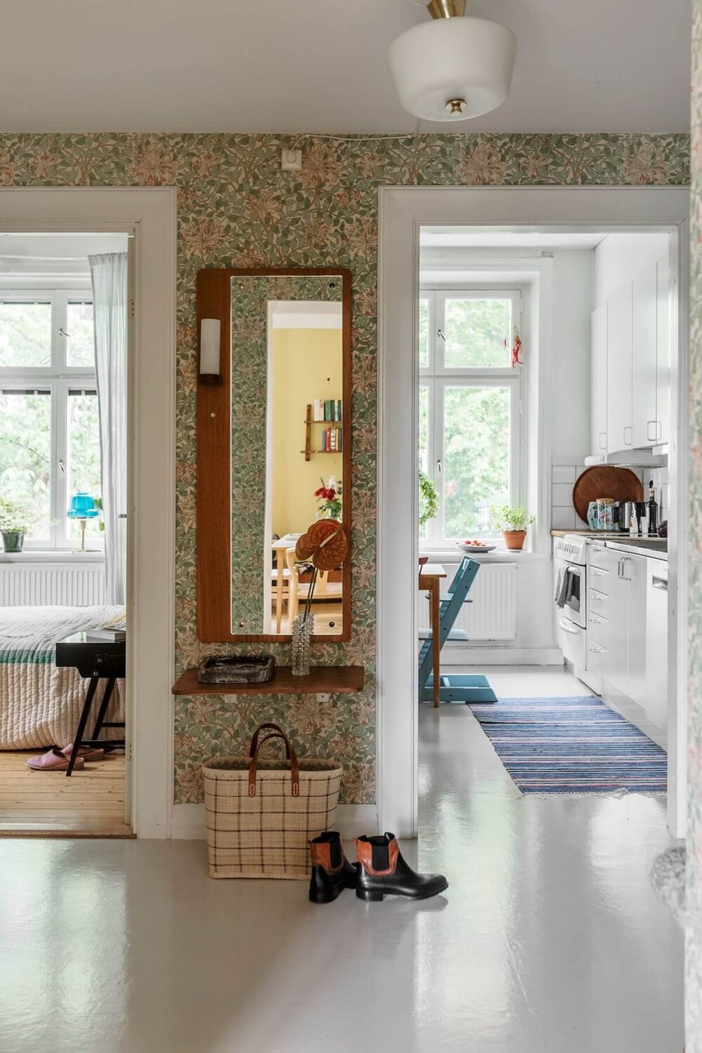 A Swedish Apartment with a Yellow Living Room 15 hallway with wallpaper
