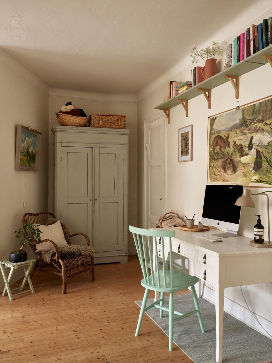 A Charming Swedish Apartment with a Cottage-Style Kitchen 7 home office pastel blue chair shelves nordroom