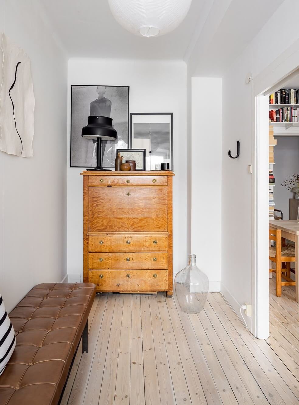 A Light Apartment with a Stainless Steel Kitchen 10 home office wooden floor bench