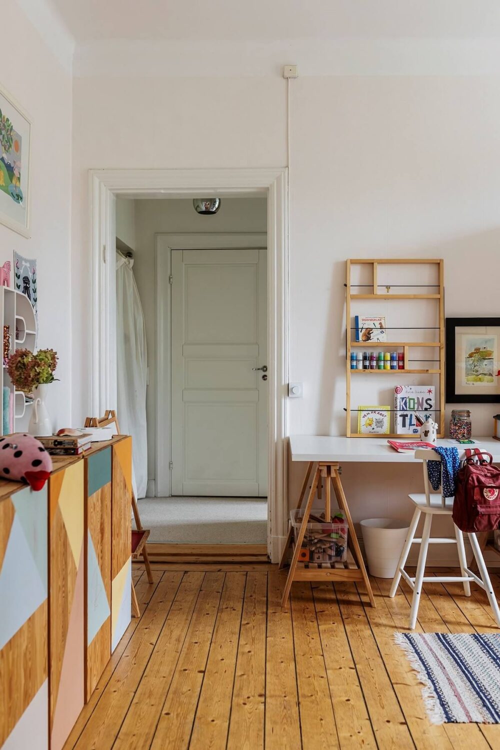 A Swedish Apartment with a Yellow Living Room 11 home office wooden floor ikea ivar cabinets nordroom