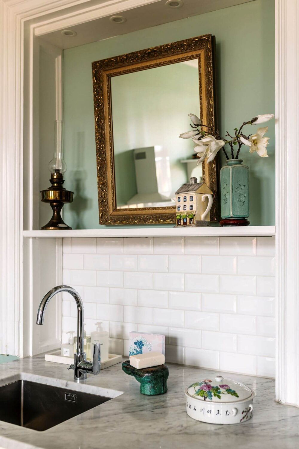 Why Everyone’s Adding Mirrors to Their Kitchens (And You Should Too) 13 kitchen-detail-mirror-mint-green-walls-nordroom