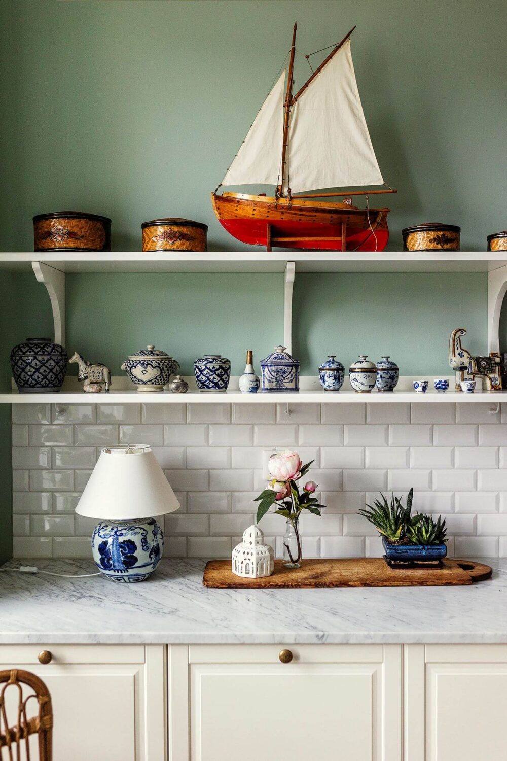 Stunning Fireplaces in a Historic Stockholm Apartment 15 kitchen-detail-shelves-mint-green-wall-paint-nordroom