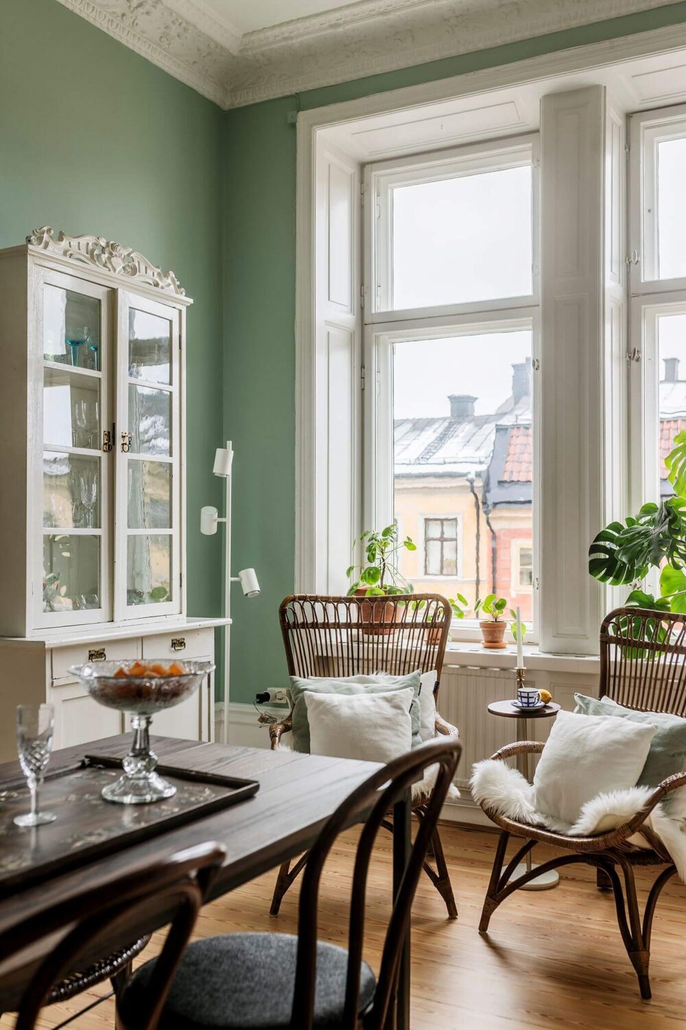 Stunning Fireplaces in a Historic Stockholm Apartment 16 kitchen-dining-table-lounge-chairs-mint-green-walls-nordroom