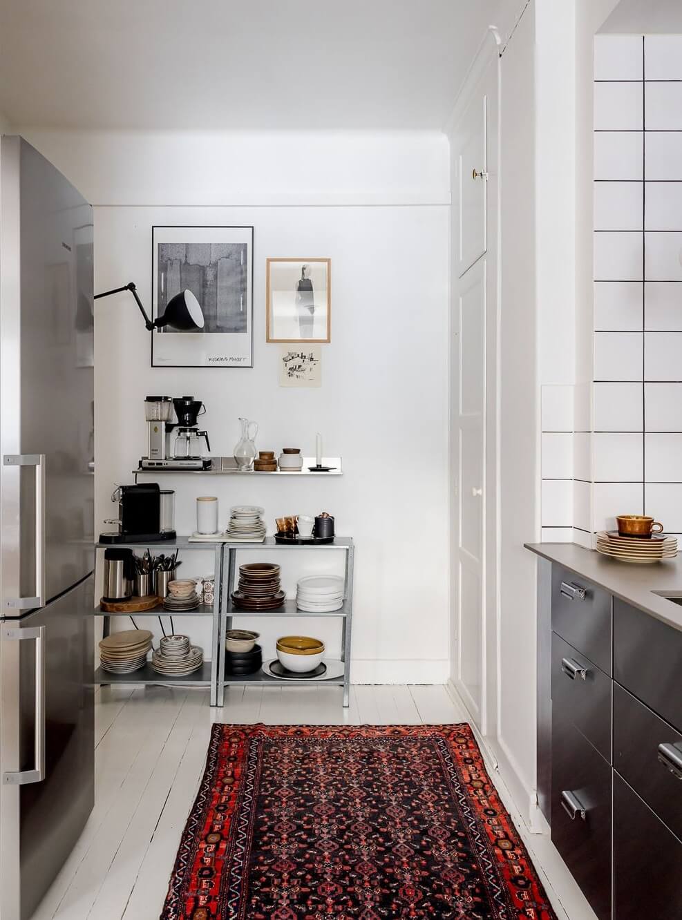 A Light Apartment with a Stainless Steel Kitchen 15 kitchen stainless steel cabinets red rug nordroom