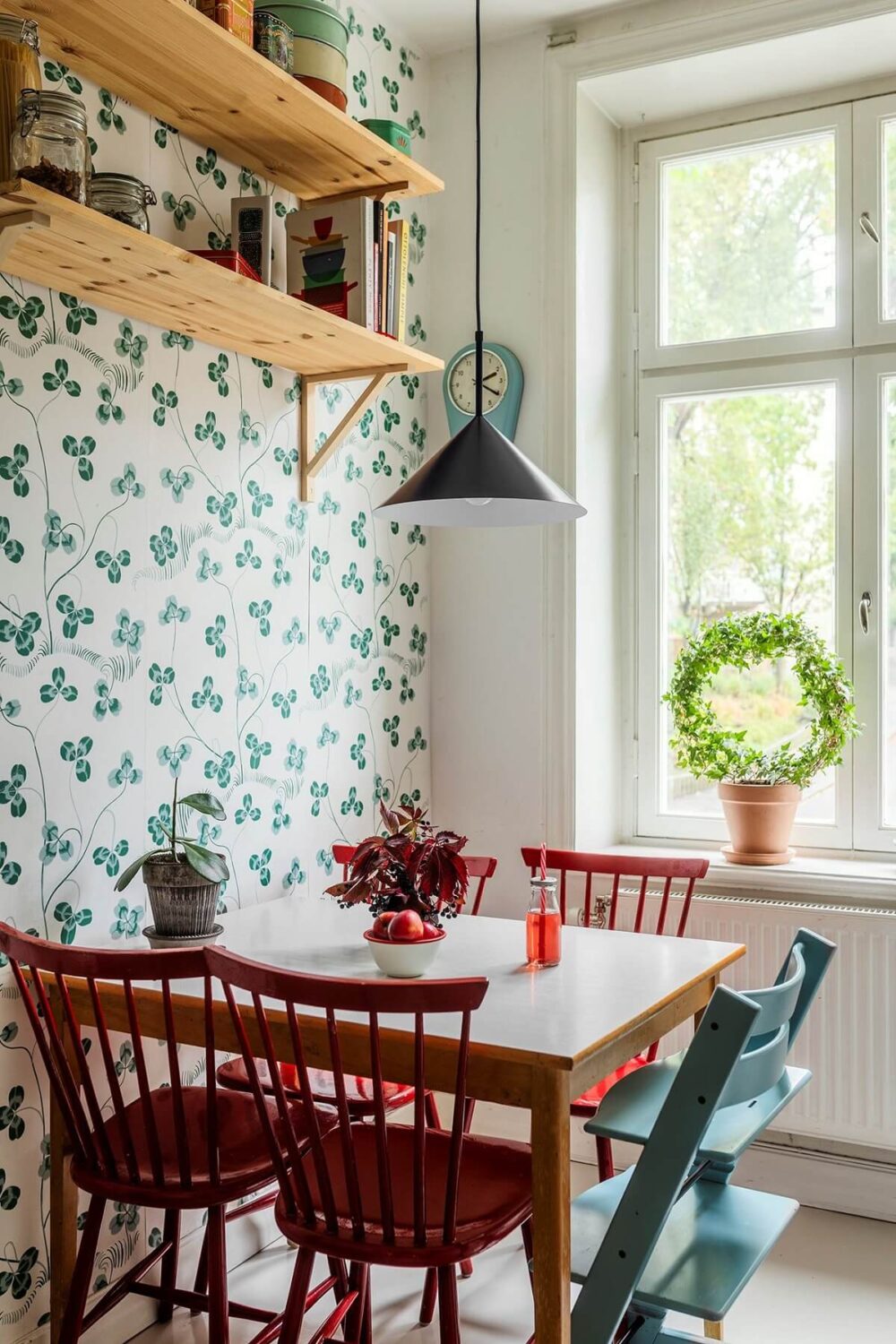 A Swedish Apartment with a Yellow Living Room 6 kitchen table wallpaper wooden shelves nordroom