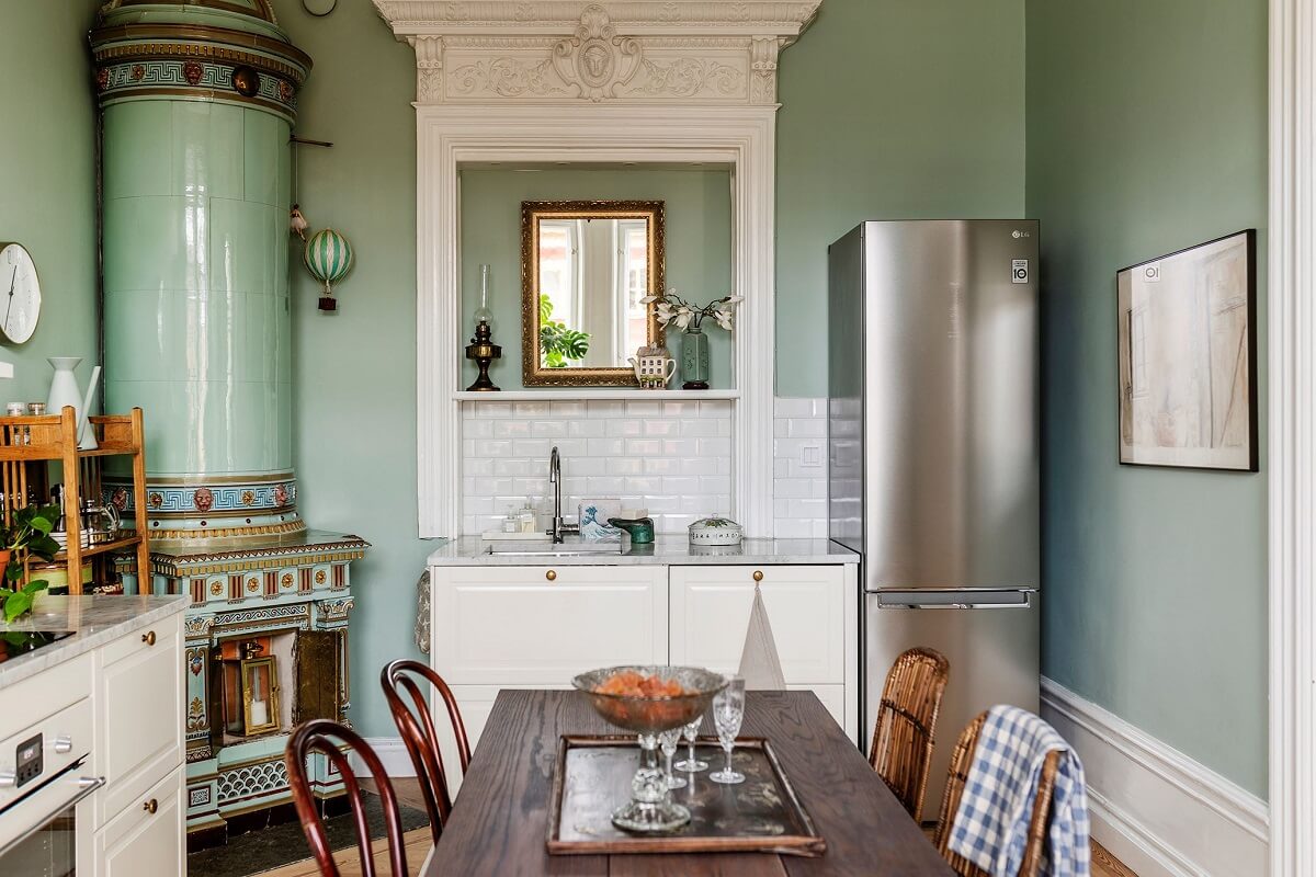 Stunning Fireplaces in a Historic Stockholm Apartment 11 kitchen-white-cabinets-mint-green-walls-fireplace-nordroom